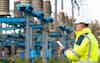 Electrical worker engineer working with digital tablet near tower with electricity adb 462914854
